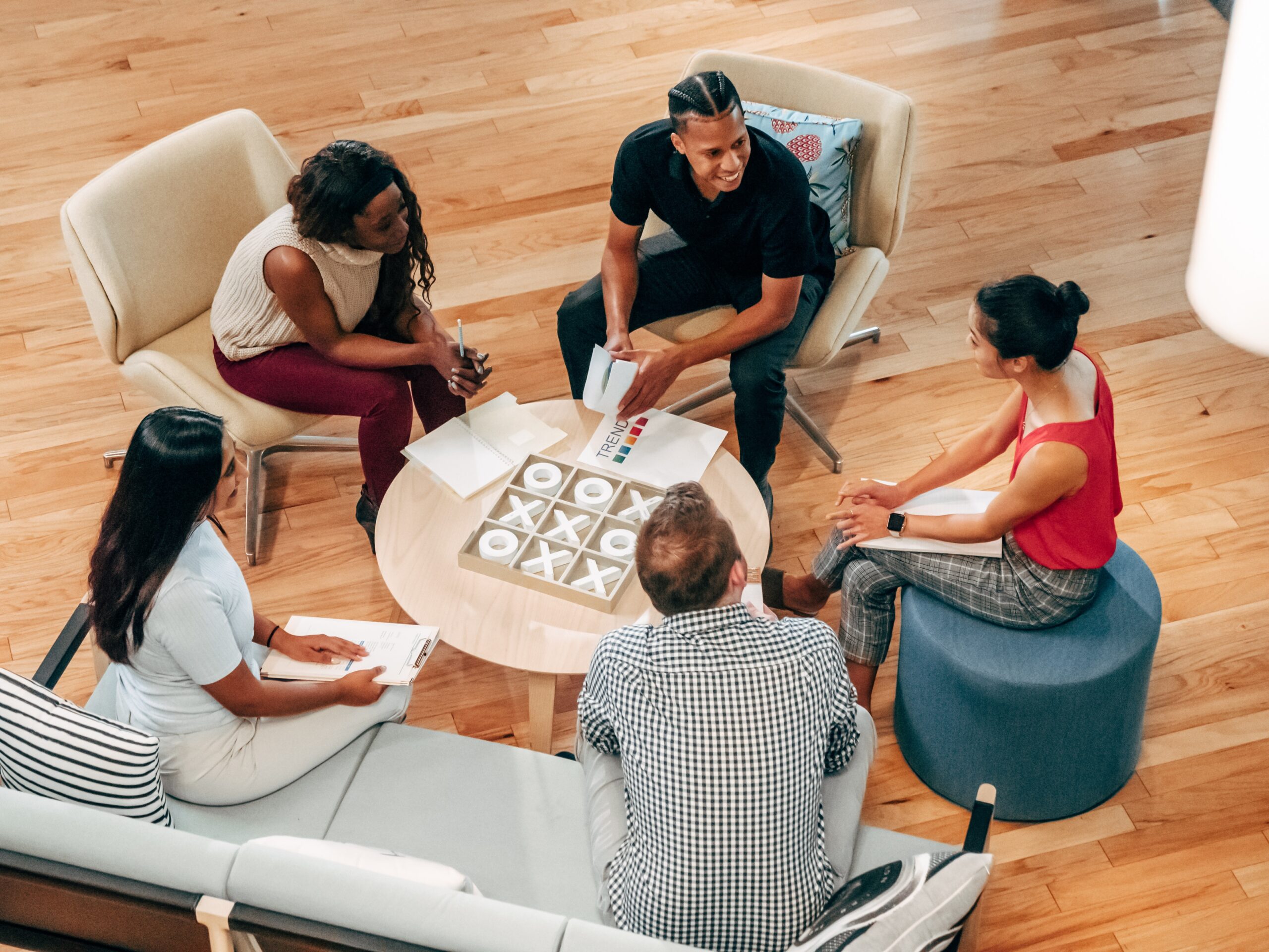 A group of business professionals networking and collaborating in a meeting.